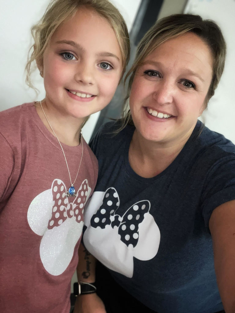 rowyn wears heather pink t shirt with white sparkle minnie ears on it, mrs. burns-pisano wearing a blue heathered t shirt with white sparkle mini ears on it