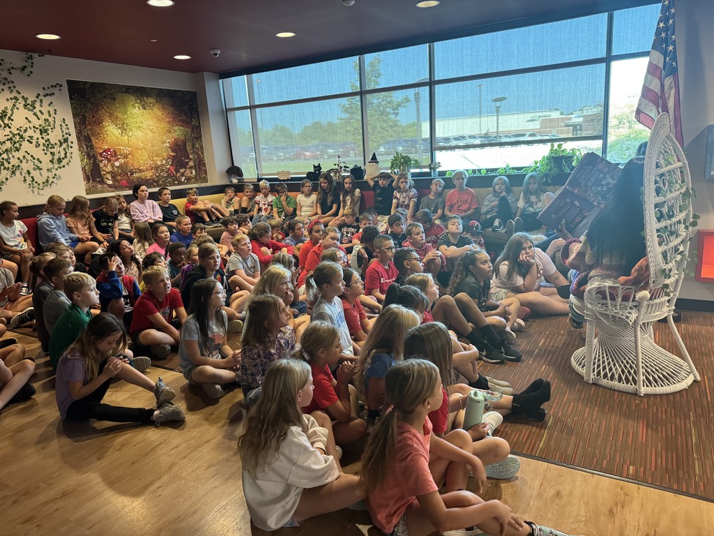 Students listening to Mrs. Humerickhouse read a book.