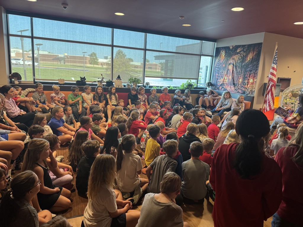 Students listening to Mrs. Humerickhouse read a book.
