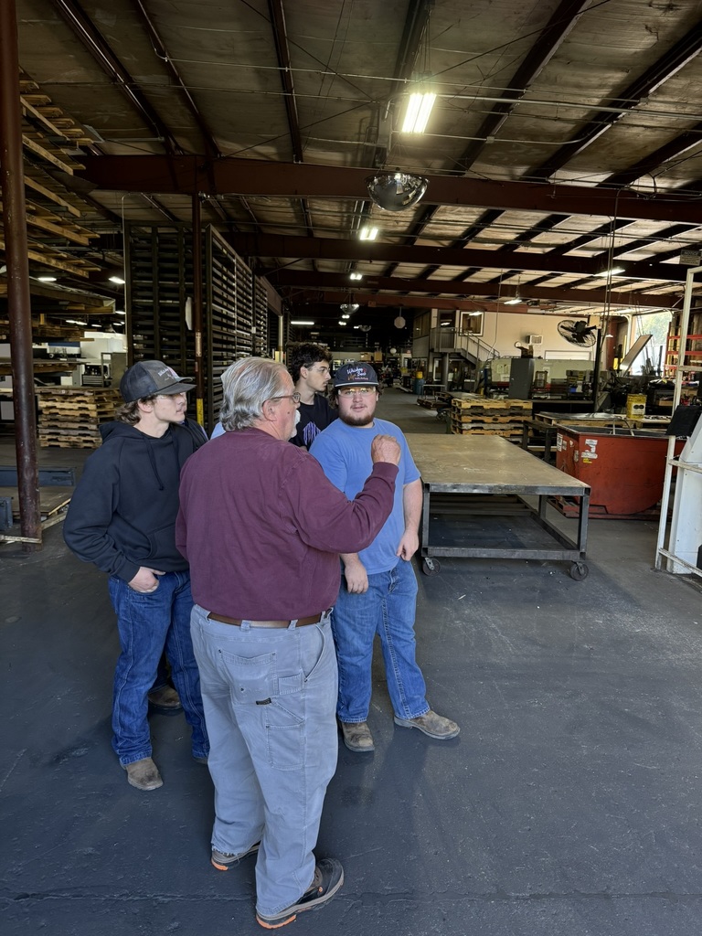 high school students touring a metal fabrication plant