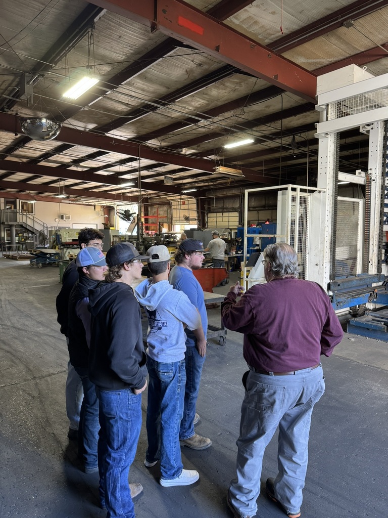 high school students touring a metal fabrication plant