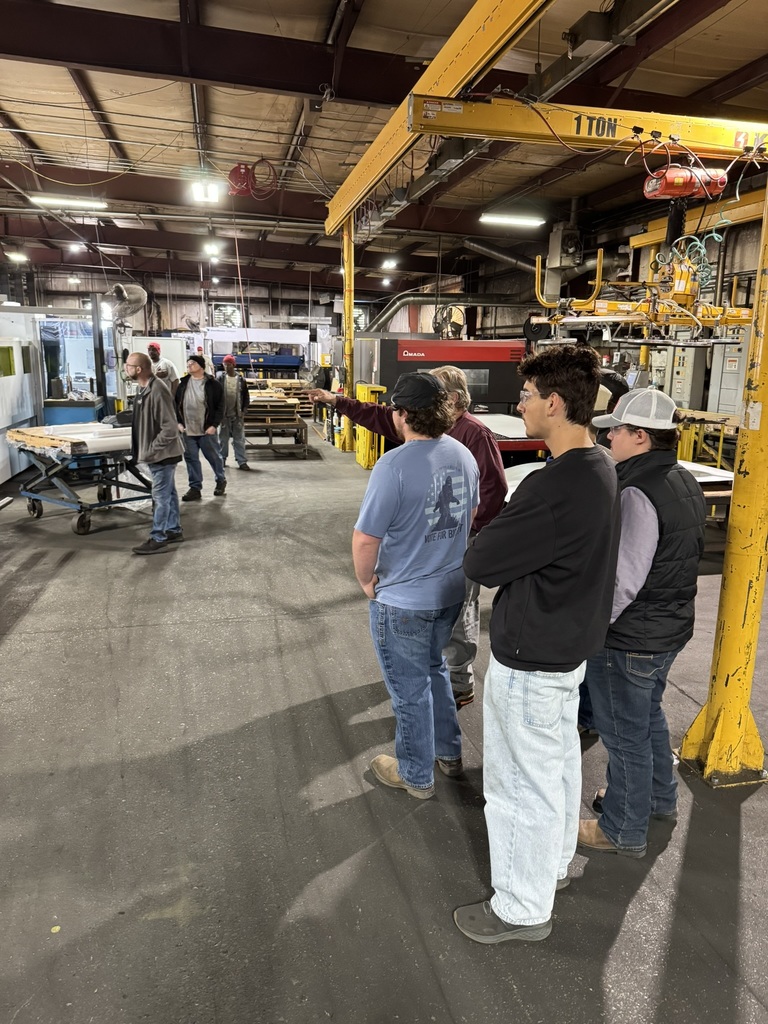 high school students touring a metal fabrication plant