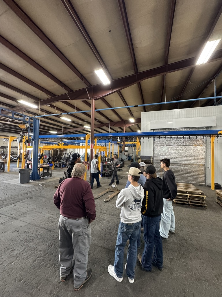 students touring a metal fabrication plant