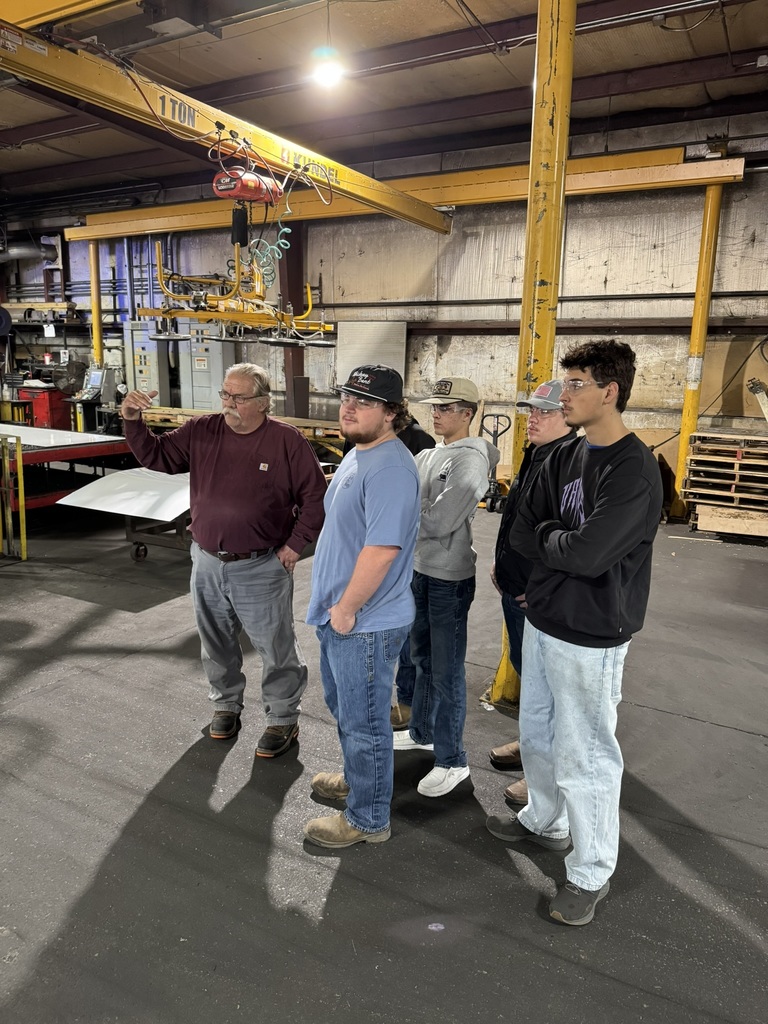 high school students touring a metal fabrication plant
