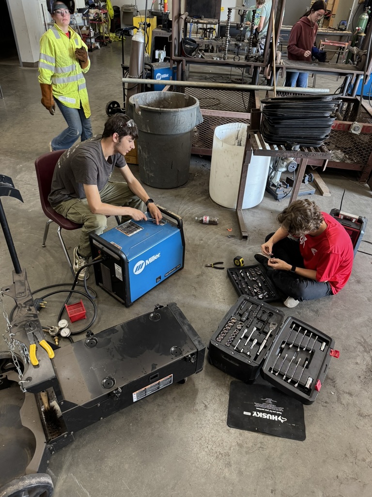 three students sort tools 