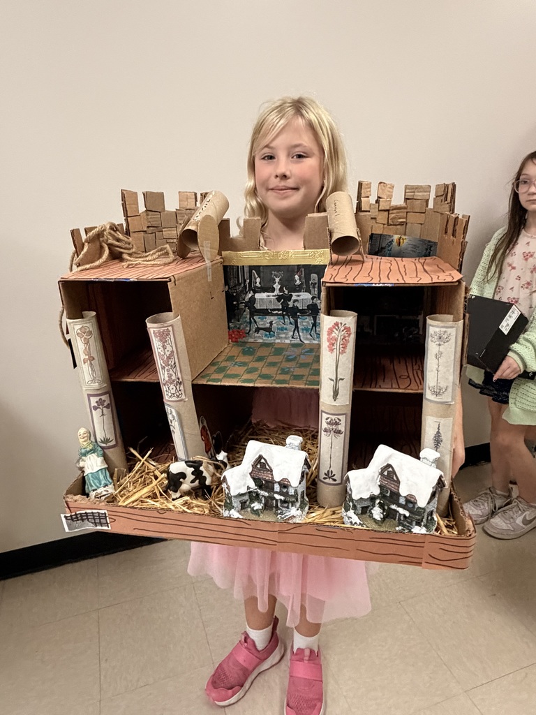 Cecelia Gardner in Miss. Shea's 4th grade class with her medieval castle.
