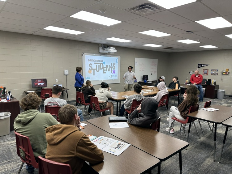 Debbie and Diego from First State Bank and Trust presenting about financial topics to Success Center Students
