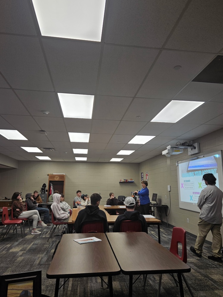 Debbie and Diego from First State Bank and Trust presenting about financial topics to Success Center Students