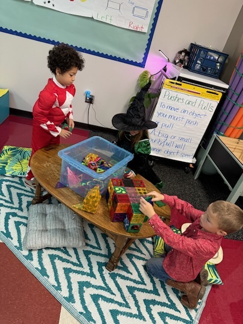 Kindergarten students in costumes celebrating Halloween. 