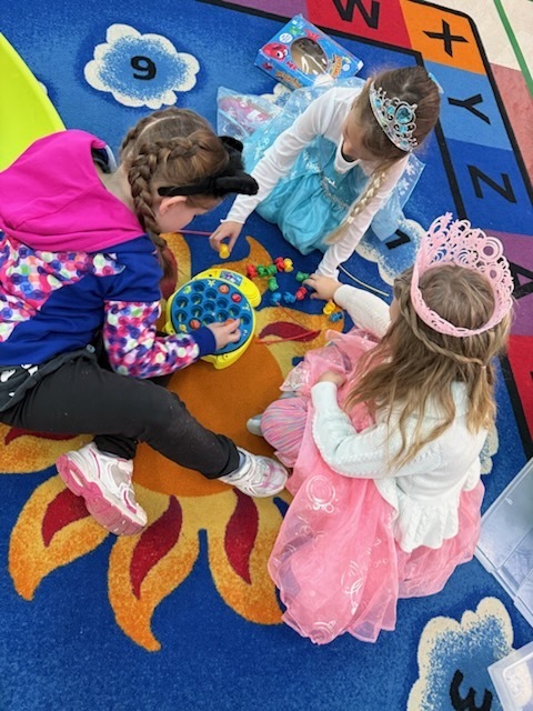 Kindergarten students in costumes celebrating Halloween. 