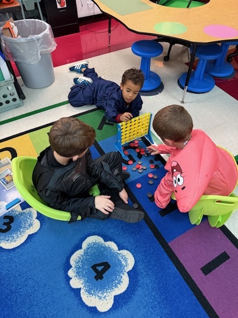 Kindergarten students in costumes celebrating Halloween. 