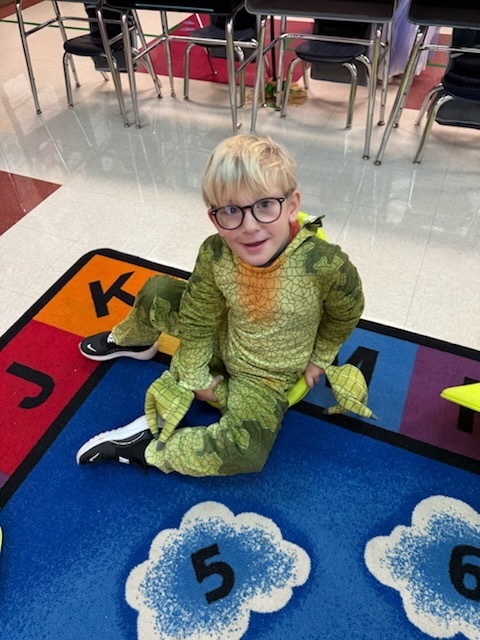 Kindergarten students in costumes celebrating Halloween. 