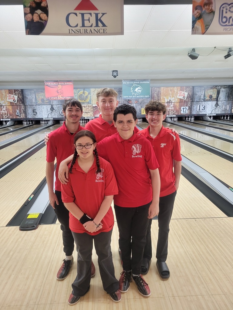 five high school bowlers wearing bowling shoes, black pants, and red polos