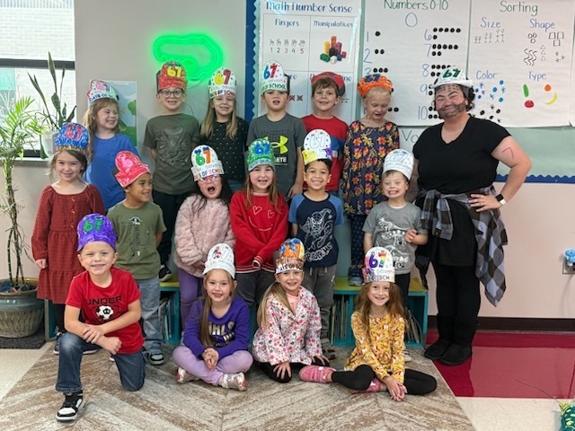 Mrs. DeKeyser's class posing with their 67 hats!