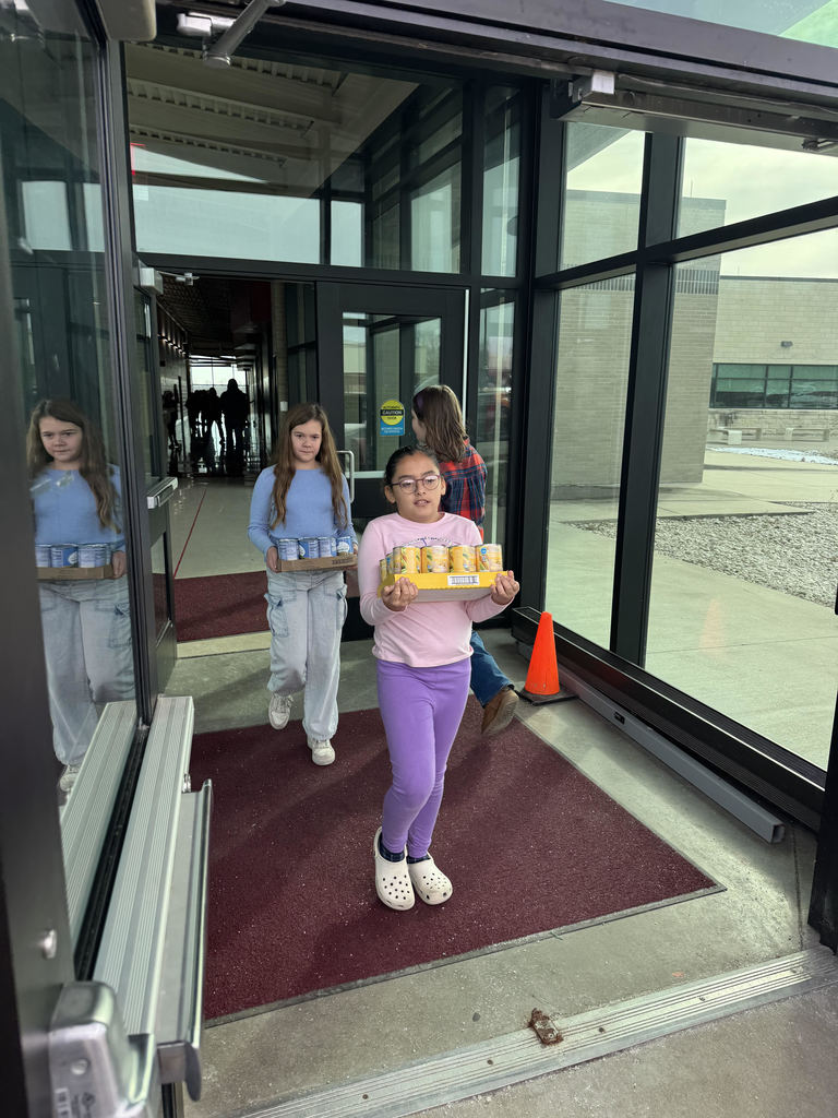 Mrs. Schaecher's class loading up canned goods.