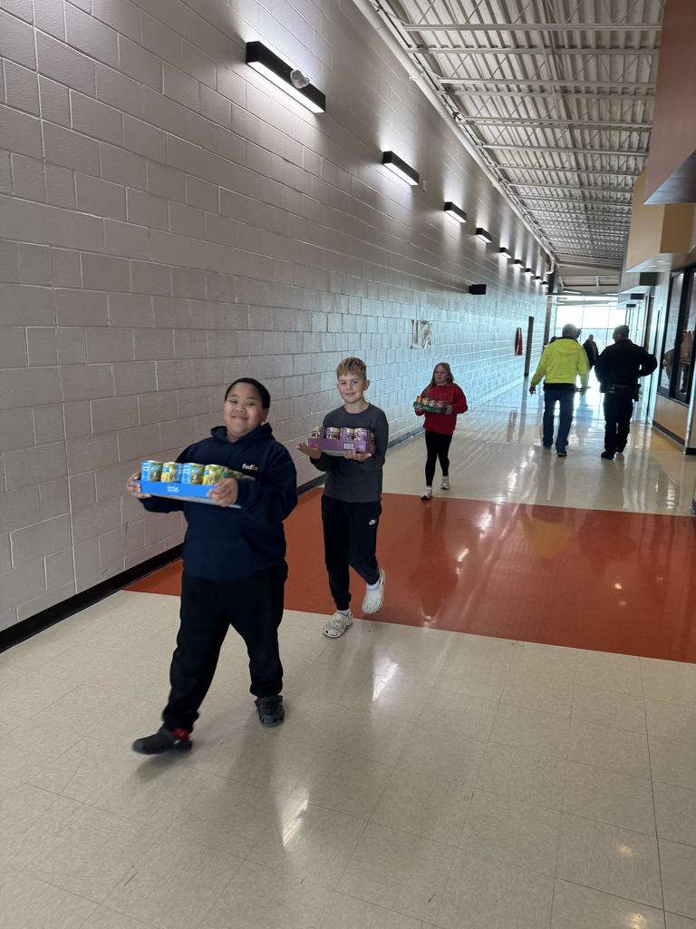Mrs. Schaecher's class loading up canned goods.