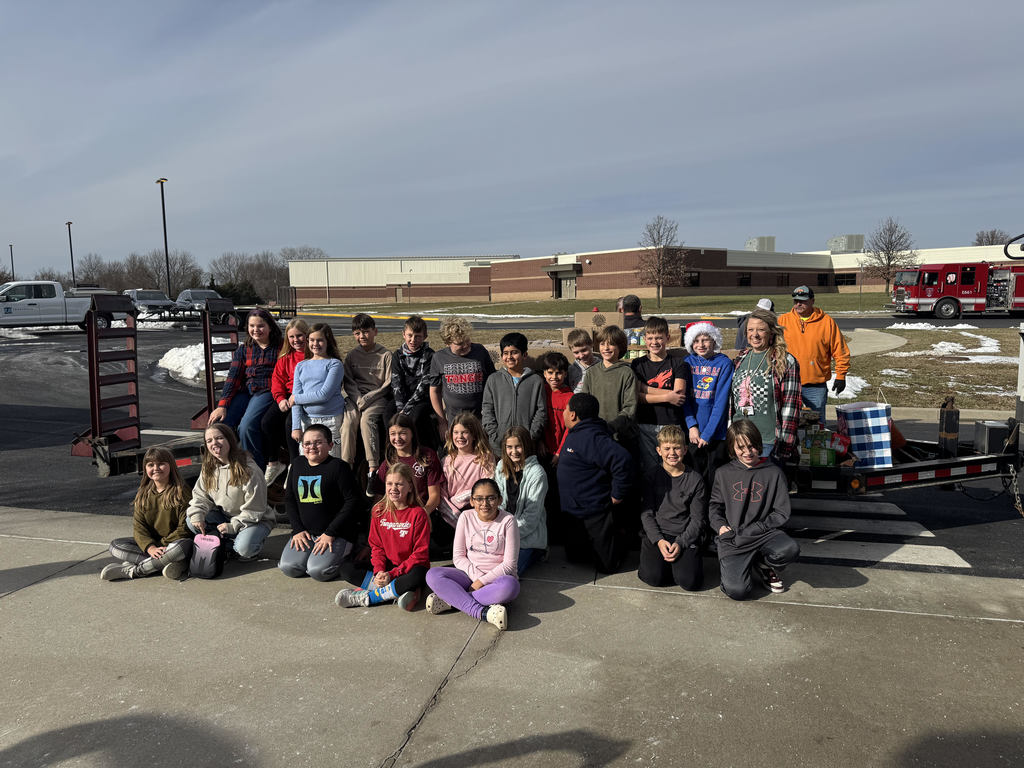 Mrs. Schaecher's class loading up canned goods.