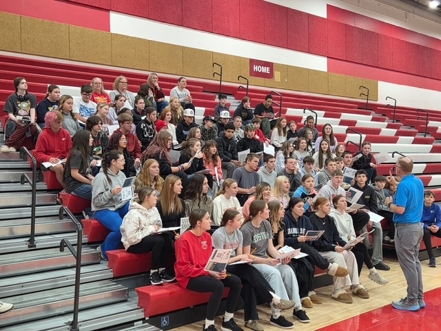 Patrick Sehl addresses students regarding the Reality U event and the importance of financial literacy