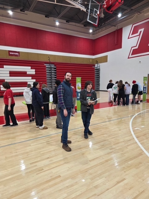 TMS Assistant Principal, Hayes Farwell, walking around the Reality U event interacting with student participants