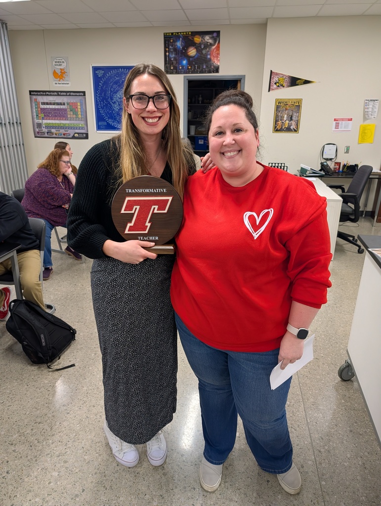Kaelyn accepting the award from Lexie