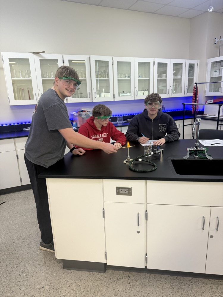 students doing a chemistry flame lab 