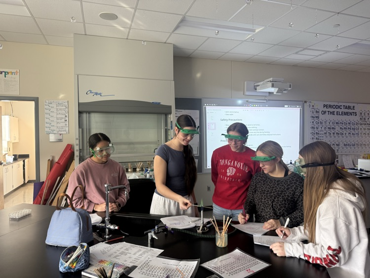 students doing a chemistry flame lab 