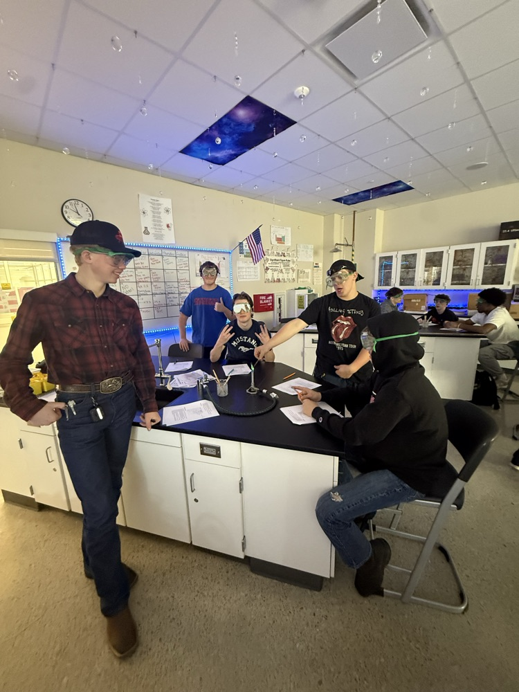 students doing a chemistry flame lab 