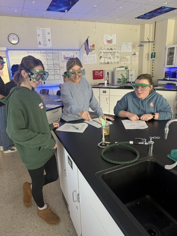 students doing a chemistry flame lab 