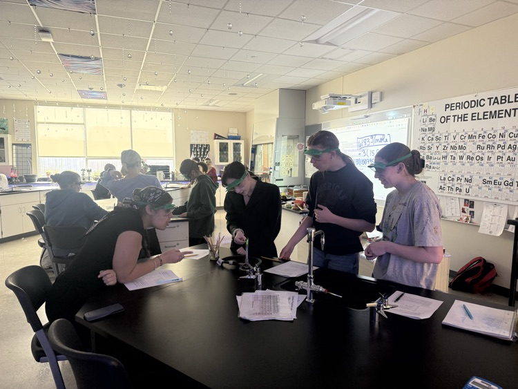 students doing a chemistry flame lab 