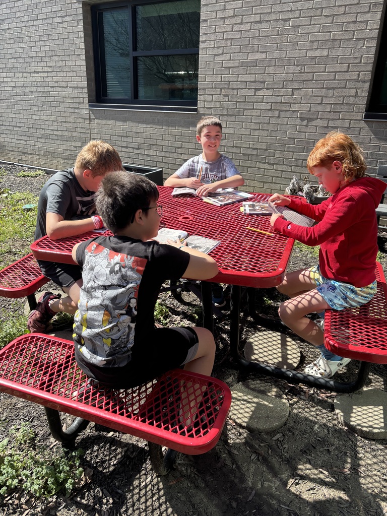 Mrs. Willis’ class enjoying the warm weather during their reading time.