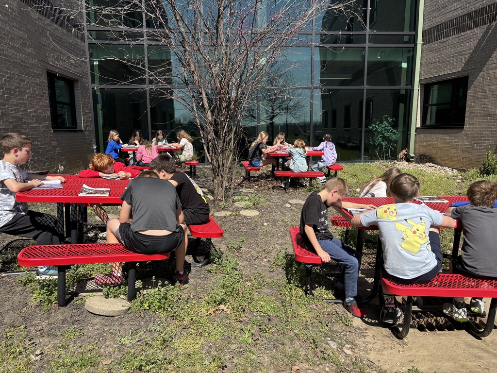 Mrs. Willis’ class enjoying the warm weather during their reading time.