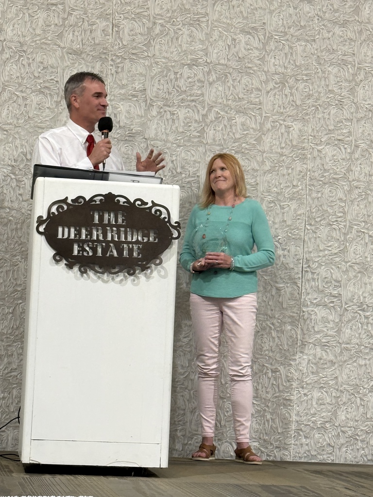 Kathy Harrell receives the Excellence in Teaching award.