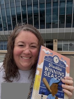 Mrs. Streeter at the Royals stadium with her book.