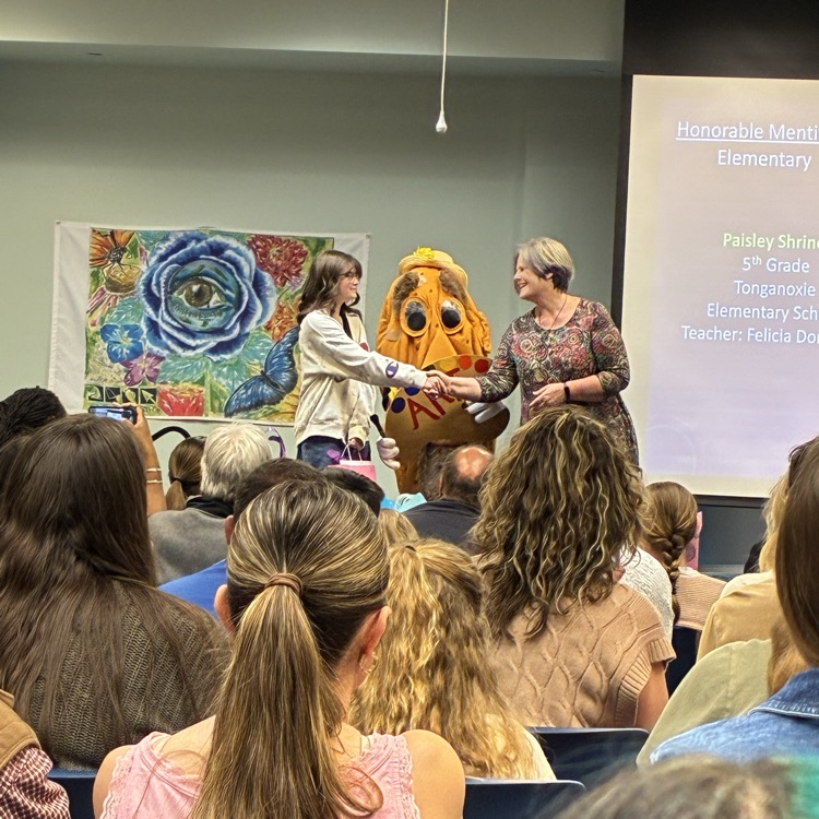 Paisley, shaking hands with one of the yam representatives