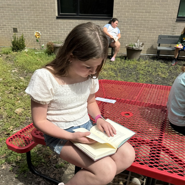 Mrs. Olsen’s class reading outside