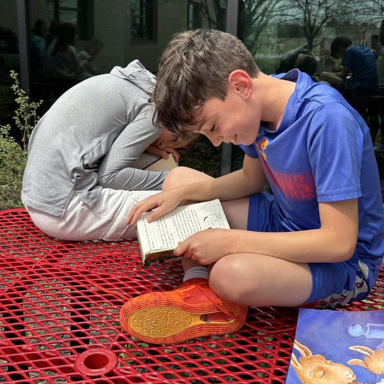 Mrs. Olsen’s class reading outside.