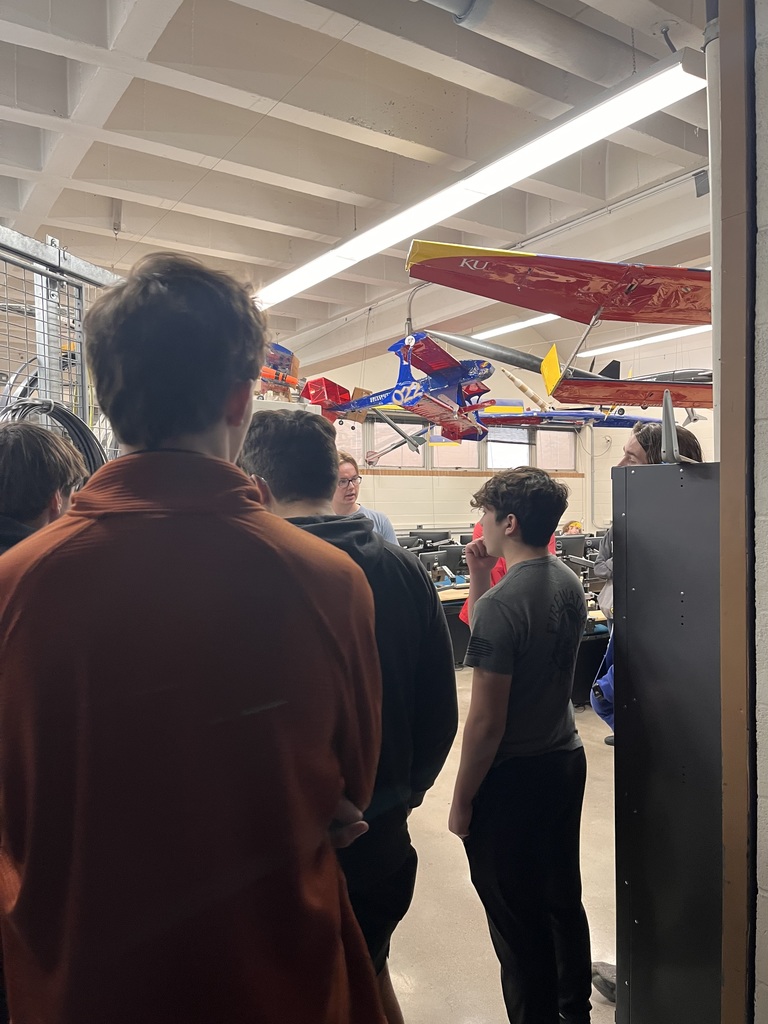 Engineering students learning about a wind tunnel.