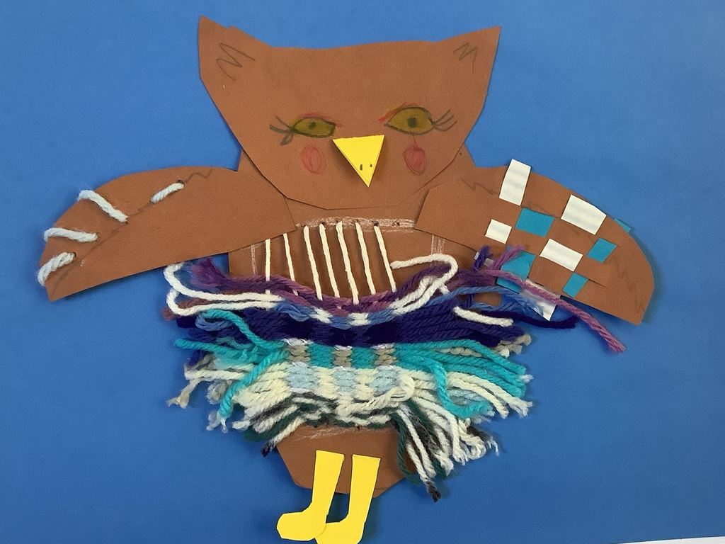 fibers project with yarn and stitching and paper weaving 