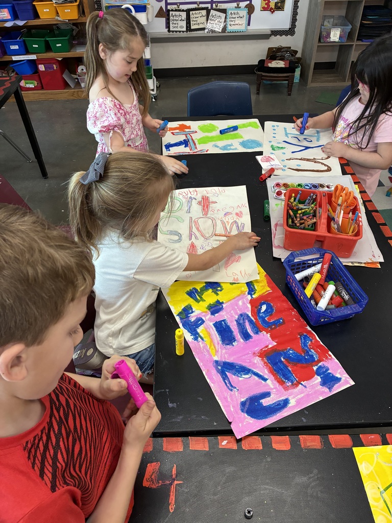 students making art show posters