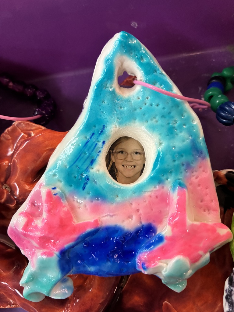 Ceramic rocket frame with a photo of a student