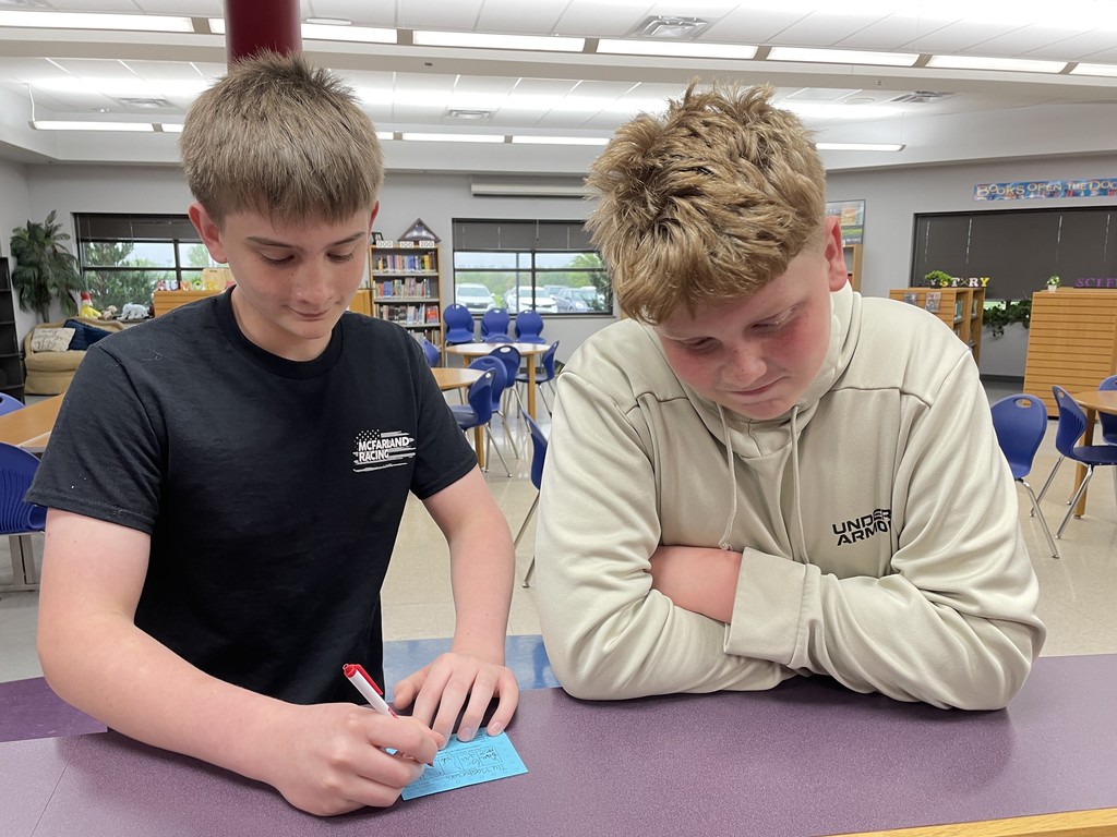 Sam is at it again—signing another blue card! 😬 Poor Tru… looks like our Principal for the Day is staying busy!