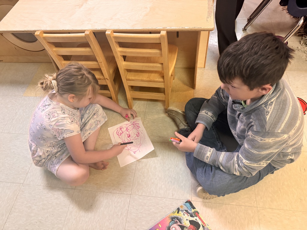 Students coloring pictures