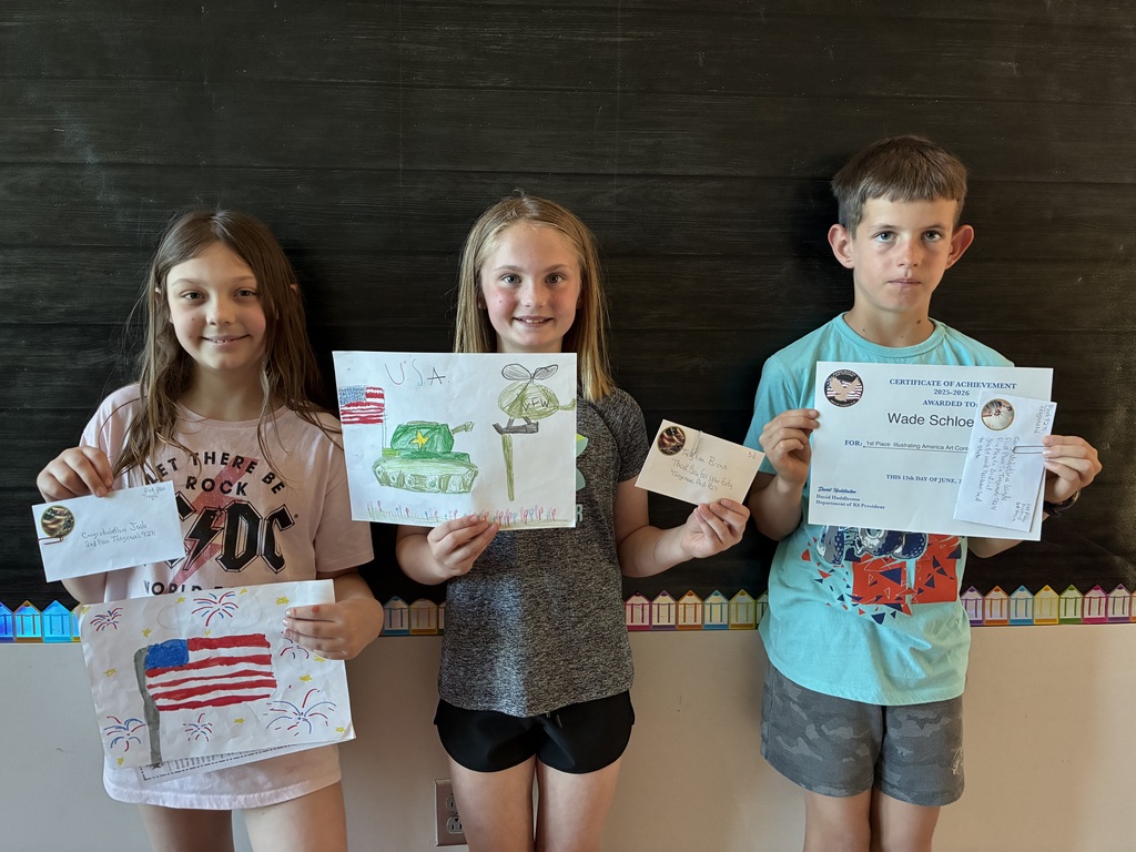 students holding artwork and certificates 