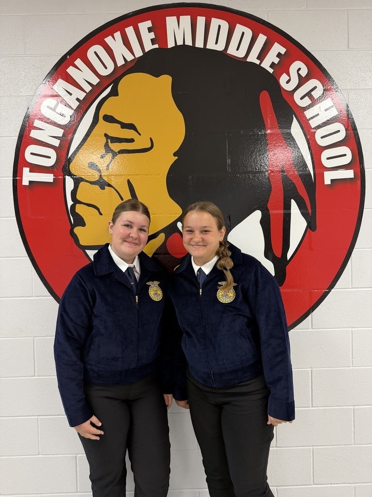 Two girls in FFA official dress posed