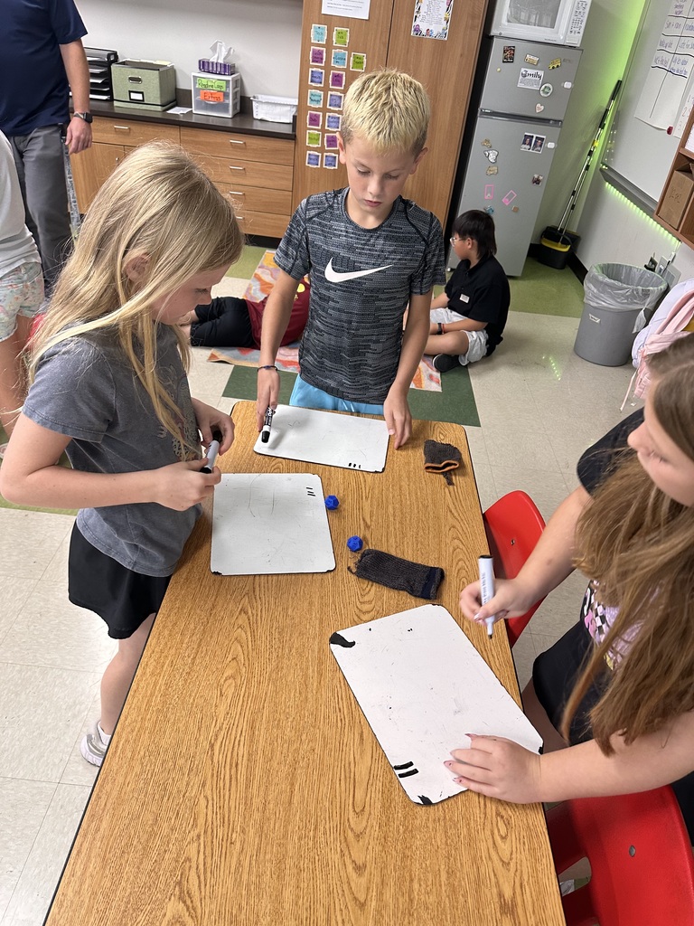 Students are practicing their multiplication math facts with a hands on dice activity.