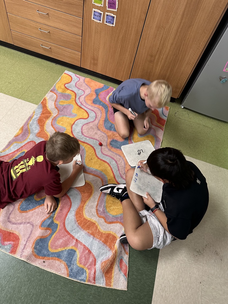 Students are practicing their multiplication math facts with a hands on dice activity.