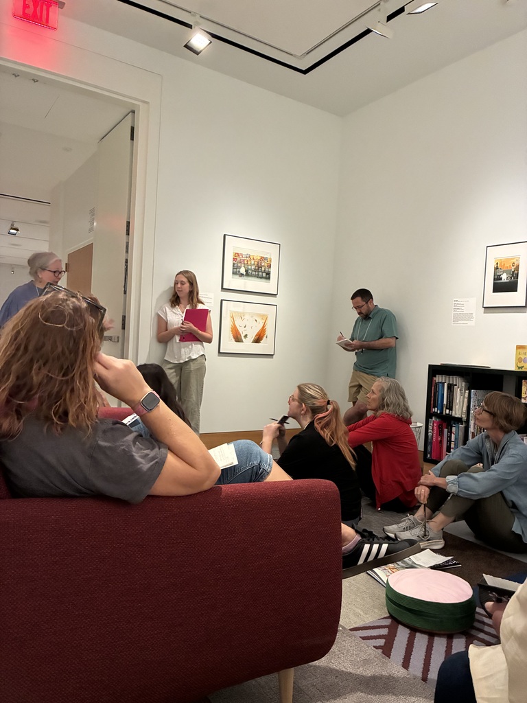 Educators looking at a piece of art and responding with poetry