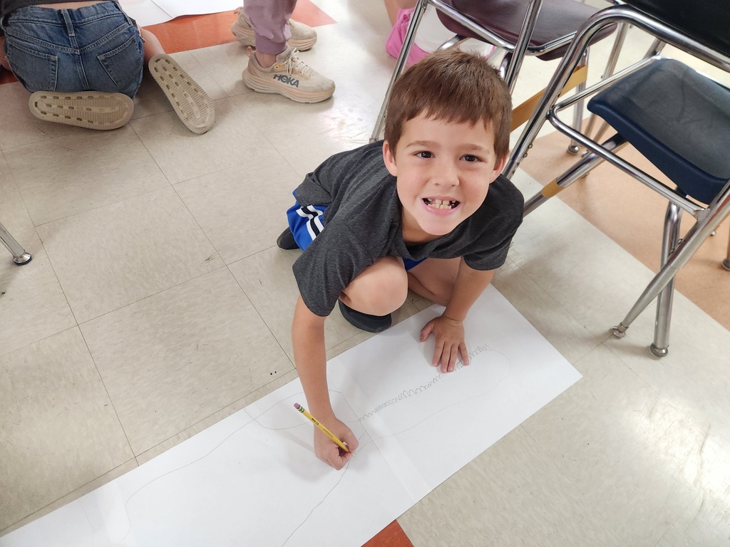 Students drawing and decorating their wingspan