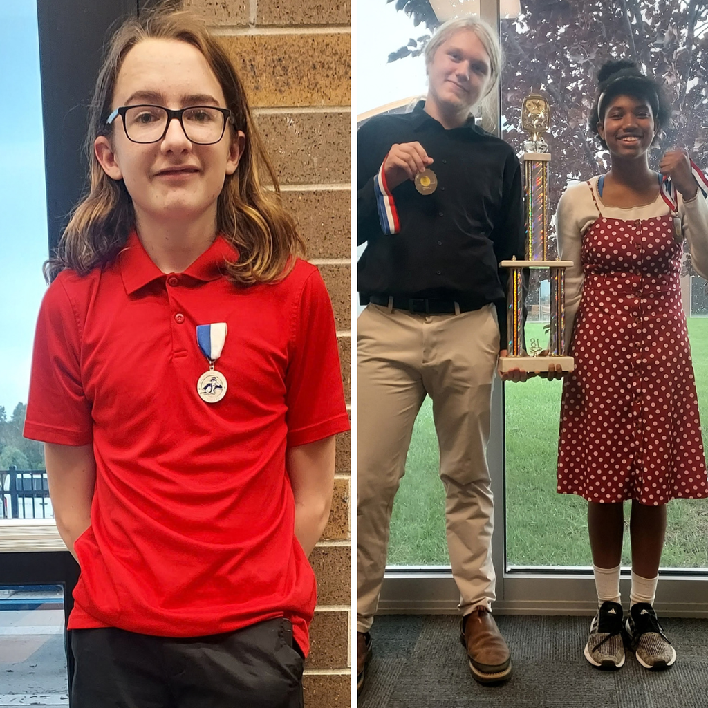 Tongie's novice debaters show off their new hardware.