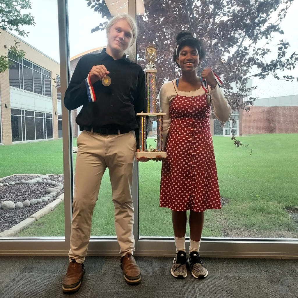 Stephen Sedgwick (left) and Aireanna Helms-Jones (right) display their first place medals in the novice division and Tongie's 1st place sweepstakes trophy at Saint James Academy on Saturday, September 26th.